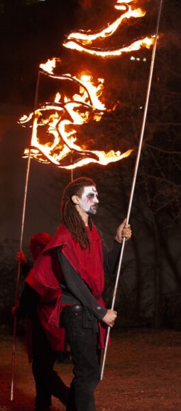 Fire performer Pedro Julio Becquer Jr. during a show. BareBones Extravaganza 2022. Photo by Paul Irmiter.