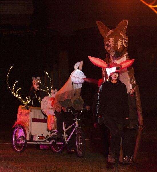 Deer and chariot by artist Eva Adderley performing a procession. BareBones Extravaganza 2022. Photo by Paul Irmiter. 