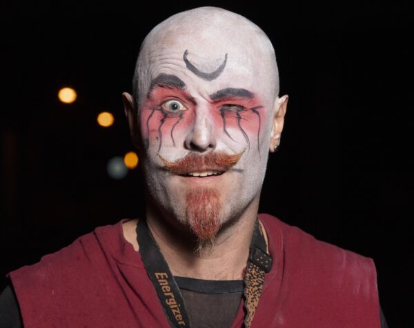 Fire performer Eddy Wilbers posing for a portrait pre-show. BareBones Extravaganza 2022. Photo by Paul Irmiter.